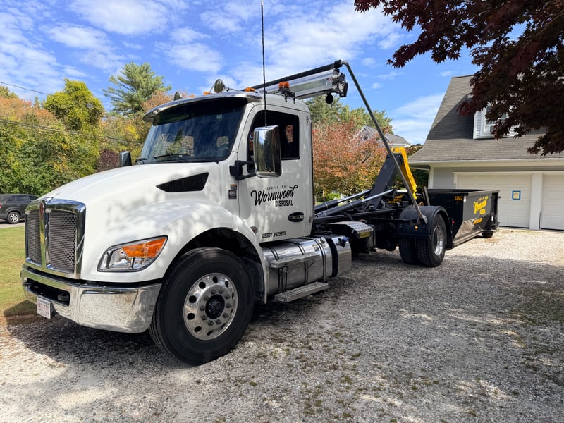 Wormwood Disposal Truck with dumpster delivery