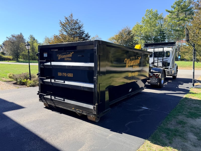 Roll off dumpster delivered to residential driveway in Raynham, MA