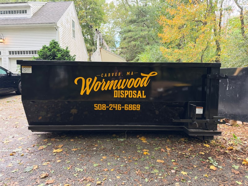Wormwood 12 Yard Dumpster on residential driveway
