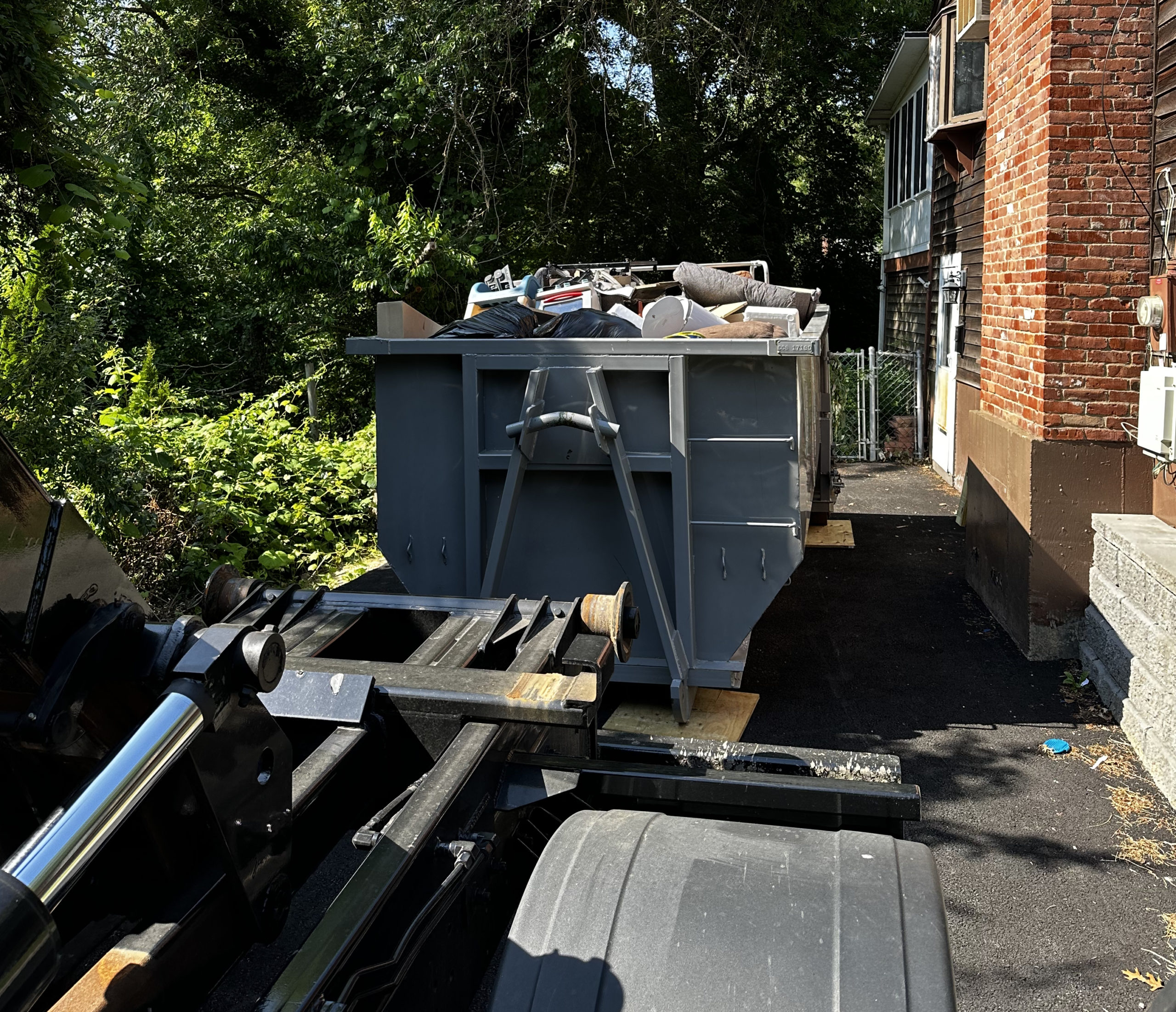 Residential Dumpster Full Of House Debris