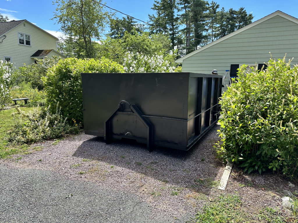 12 Yard Dumpster Placed In A Small Driveway In Pembroke, Ma