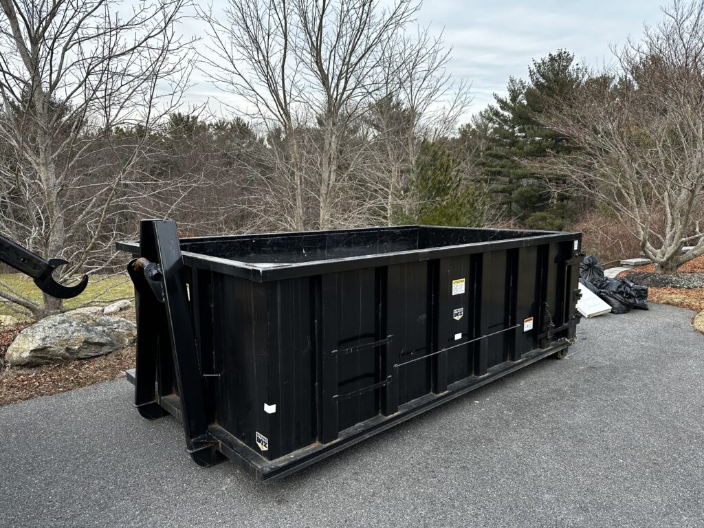 15 yard dumpster placed in a driveway in Kingston for a construction project